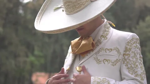 Mariacho fixes his charro suit Stock Footage 157499174