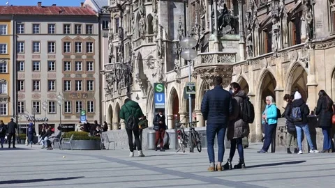 Marienplatz with locals during the german lockdown on a sunny day Stock Footage 149944174