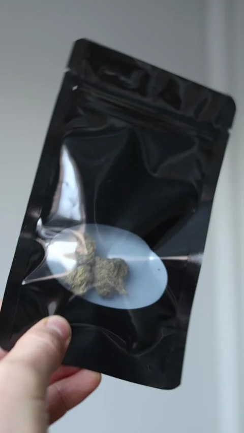 Marijuana in a bag vertical video Stock Footage 286042124