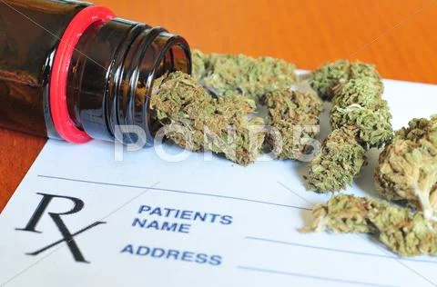 Marijuana buds with prescription paper Stock Photos