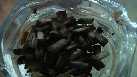 Marijuana joint and roaches in ashtray Stock Footage