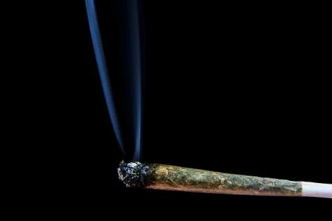 Marijuana joint with smoke Stock Photos