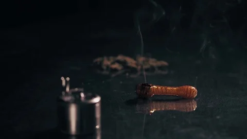 Marijuana Pipe Burning 1. A marijuana filled pipe smoking. More marijuana and a 스톡 동영상 83047978