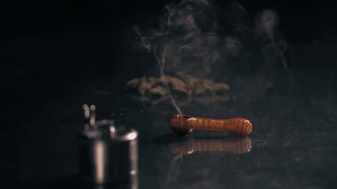 Marijuana Pipe Burning 1. A marijuana filled pipe smoking. More marijuana and a 스톡 동영상 83048032