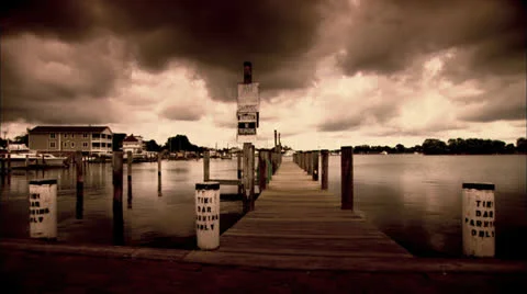 Marina on Solomons Island with Dark Clouds - Sepia Tone HD Video Stock Footage 24610073