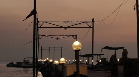 The marina at sunset with lights on Stock Footage 69021078
