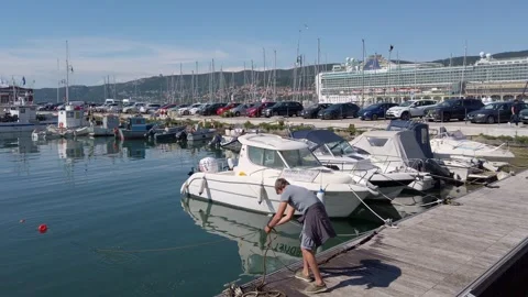 Marina in Trieste with the Lanterna Lighthouse in the Background Stock Footage 338242859