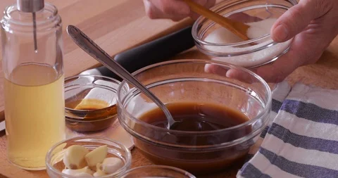 Marinade making, adding white sugar, close-up Stock Footage 106948540