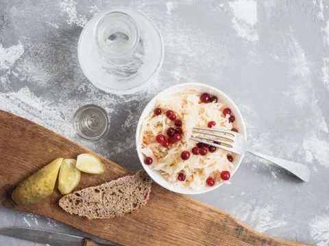 Marinated cabbage with cranberries, lightly salted cucumber, black bread and  Stock Photos