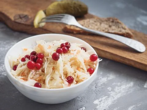 Marinated cabbage with cranberries, lightly salted cucumber, black bread Stock Photos