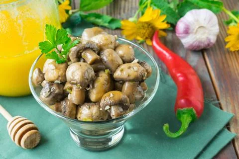 Marinated champignons with honey, vinegar and chili pepper Stock Photos