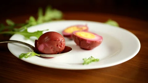 Marinated chicken eggs in beetroot marinade in a plate Stock Footage 129527244