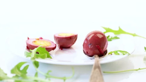 Marinated chicken eggs in beetroot marinade in a plate Stock Footage 130674657