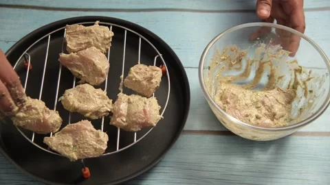 Marinated chicken serving on a grill Video stock 166091453