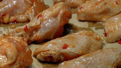 Marinated chicken wings on a baking sheet Stock Footage 86379737