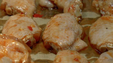 Marinated chicken wings on a baking sheet Stock Footage 86380073