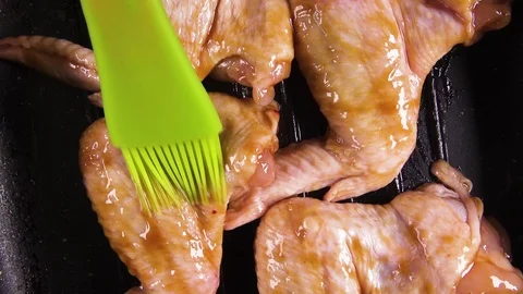 Marinated chicken wings on the surface rotate top view Stock Footage 101650743