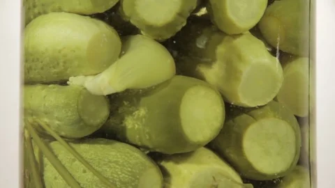 Marinated cucumbers rotating on white background Stock Footage 69947377
