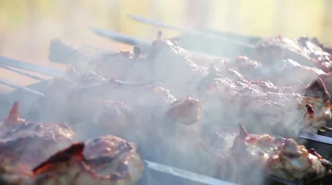 Marinated fresh chicken fried on a grill outdoors Stock Footage 66367802