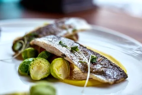 Marinated fried herring fillets. Stock Photos