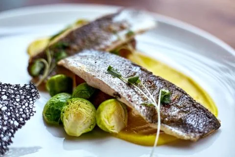 Marinated fried herring fillets. Stock Photos