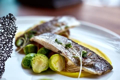 Marinated fried herring fillets. Stock Photos