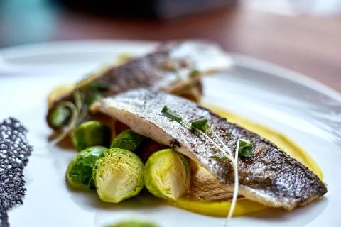 Marinated fried herring fillets. Stock Photos
