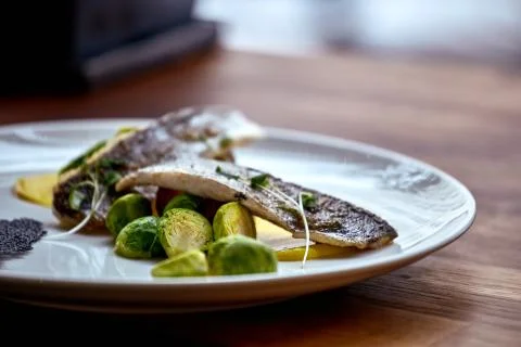 Marinated fried herring fillets. Stock Photos