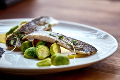 Marinated fried herring fillets. Stock Photos