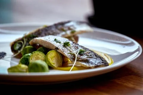 Marinated fried herring fillets. Stock Photos