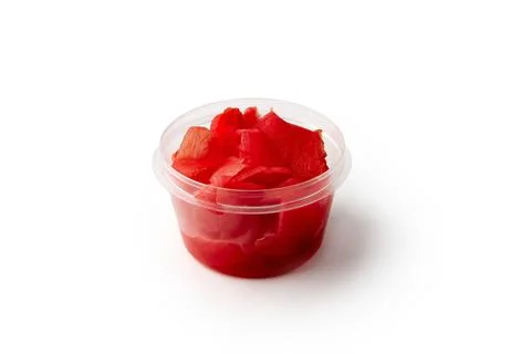 Marinated ginger in plastic container isolated on white Stock Photos