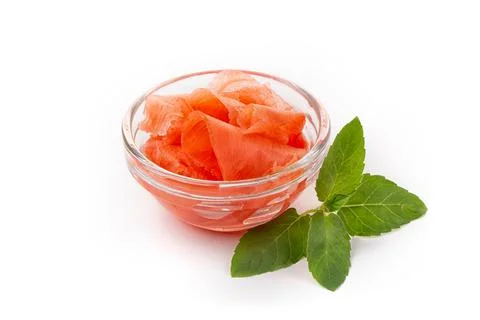 Marinated ginger slices, isolated on white background. High resolution image Stock Photos