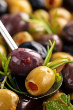 Marinated olives with herbs. Stock Photos