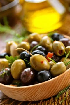 Marinated olives with herbs. Stock Photos