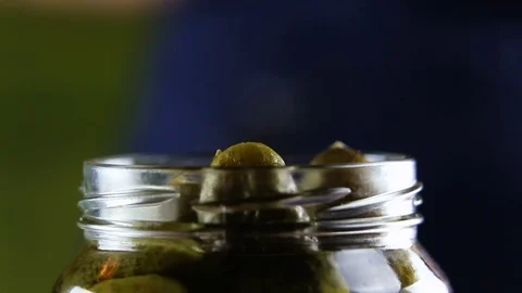 Marinated pickled cucumbers in glass jar Stock Footage 73765337