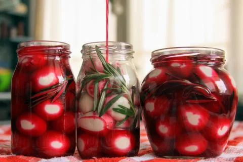 Marinated quail eggs in jars Stock Photos