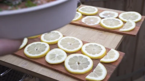 Marinated salmon chunks being arranged on a wooden boards Stock Footage 111513044