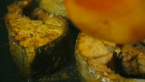 Marinated salmon steaks frying in a pan Stock Footage 317907258