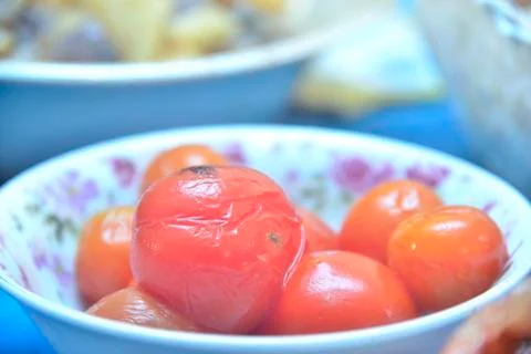 Marinated tomatoes in plate Stock Photos