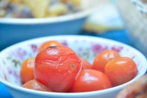 Marinated tomatoes in plate Stock Photos