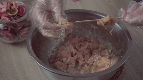 Marinating Chicken Cubes for Cooking Satay Stock Footage 290107082