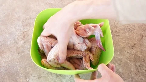 Marinating chicken. Hands marinate chicken. Chicken wings. Chicken meat Stock Footage 89929647
