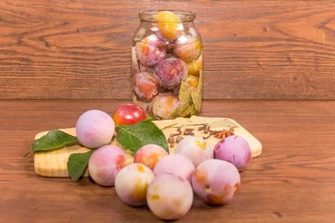 Marinating plums Stock Photos