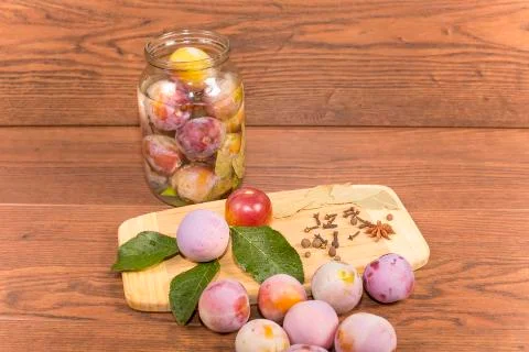 Marinating plums Stock Photos