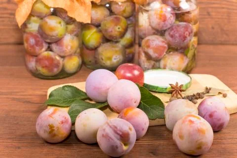 Marinating plums Stock Photos