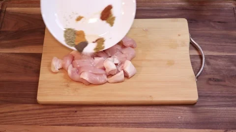 Marinating Sliced Chicken Breast With Mixed Spices by Hand Slow Motion Видео 334808199