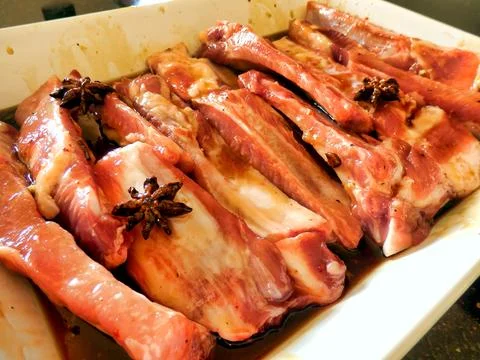 Marinating Spare Ribs. Stock Photos