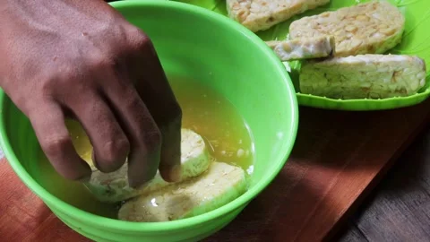 Marinating tempeh Stock Footage 342790097