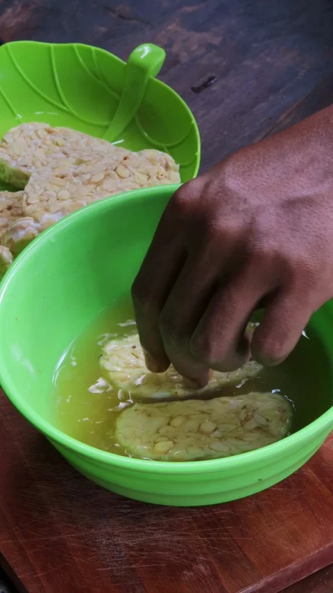 Marinating tempeh Stock Footage 342790163