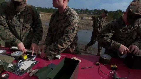 Marine building explosives during training outdoors Stock Footage 84969651